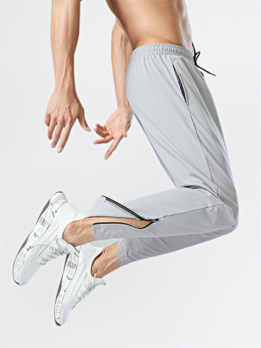 Pantalones casuales de fitness transpirables de secado rápido de seda de hielo con cordón y cremallera lateral.